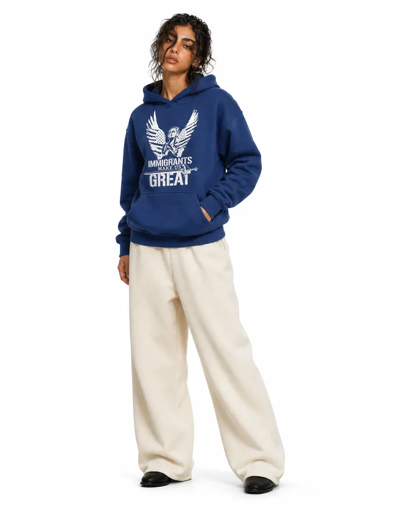 The Architect Hoodie Winged Liberty in Navy, worn, three-quarter view
