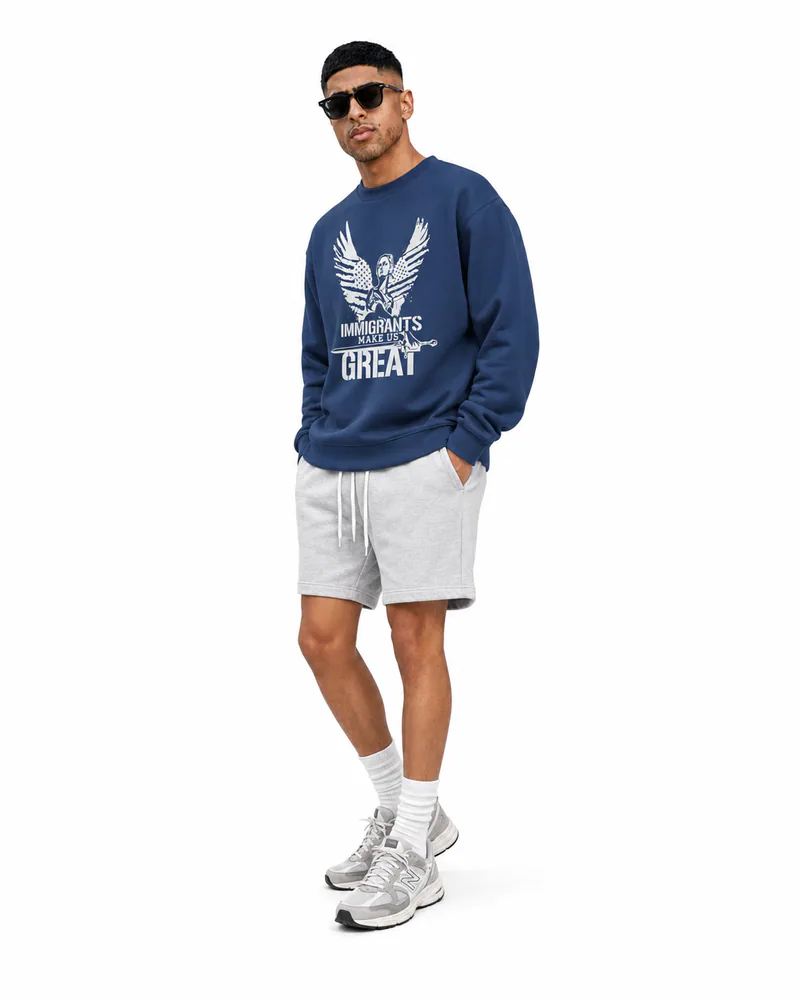 The Sovereign Crewneck Winged Liberty in Navy, worn, three-quarter view